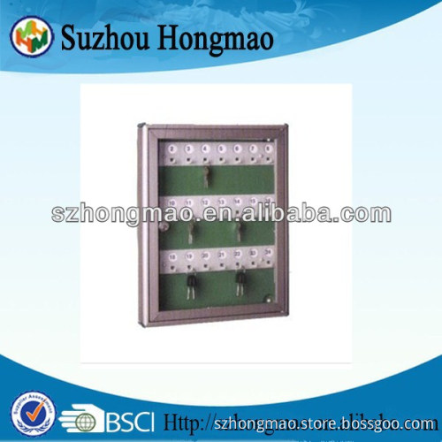 Wall mountable key cabinet with numbered hooks